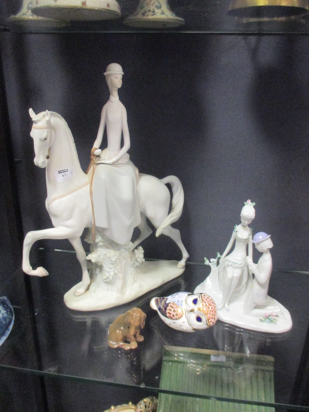 A Lladro woman riding sidesaddle, Copenhagen hound, a Rosenthall figural group and a Royal Crown