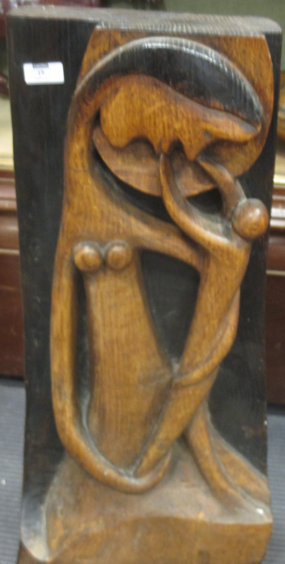 A contemporary carved and stained panel of the Madonna and Child, 62 cm high