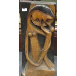 A contemporary carved and stained panel of the Madonna and Child, 62 cm high