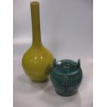A Japanese yellow monochrome bottle vase, circa 1900, 46cm high; a Chinese Shiwan teapot, Qing