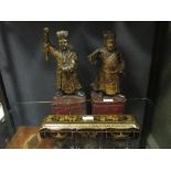 A pair of Chinese carved wood gilt figures of Mandarins, 34cm high, 20th century, and a Chinese