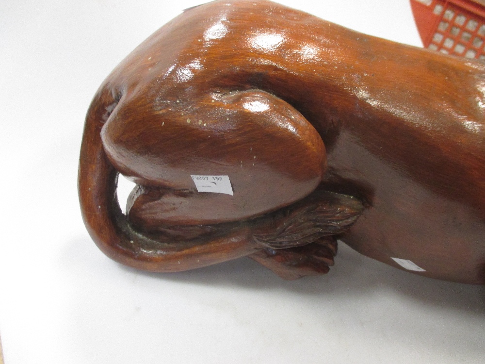 A carved and stained pine model of a recumbent lion, 59 cm wide - Image 3 of 6