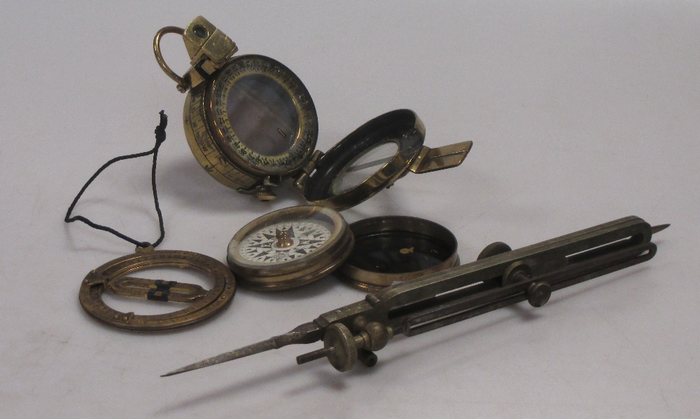 Four assorted compasses