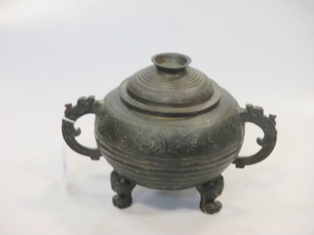 A 19th century Chinese bronze archaic style censor and cover