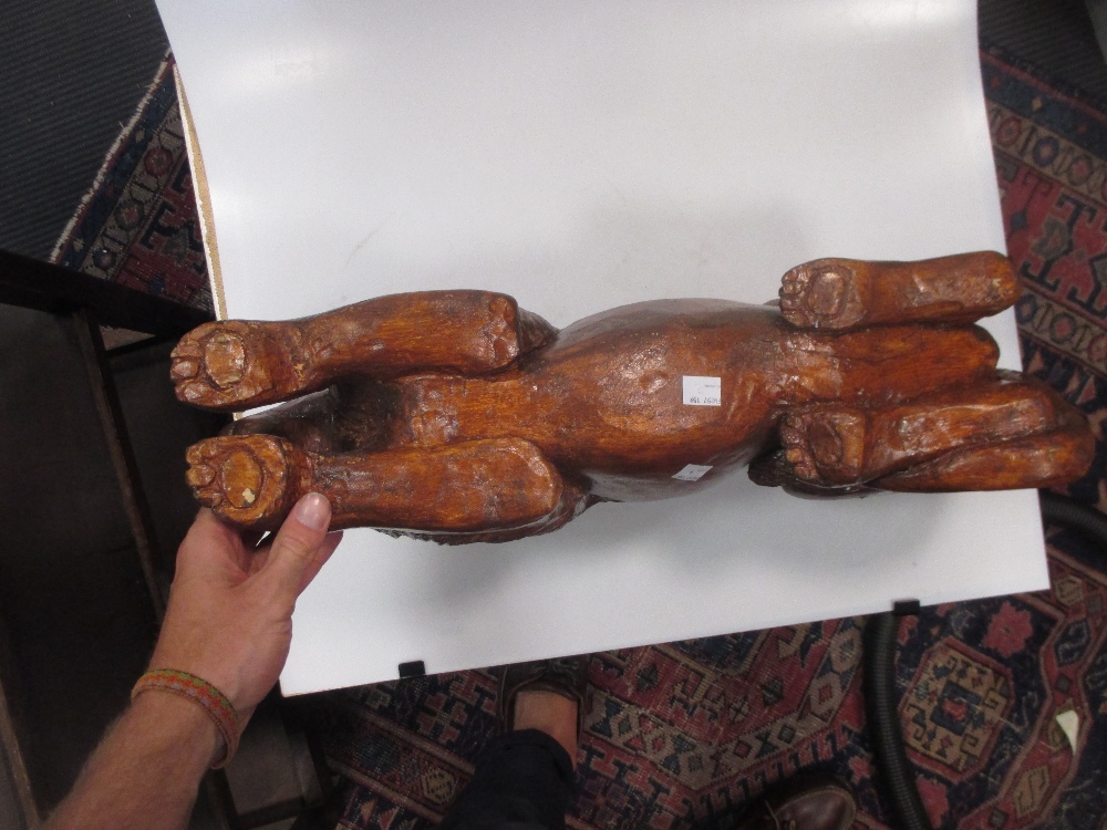 A carved and stained pine model of a recumbent lion, 59 cm wide - Image 6 of 6