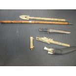 A late 19th century Eastern swordstick, a cased bone blow pipe, a WWII USA bayonet etc