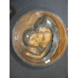 A carved oak roundel with the face of the Madonna and Child, modern, 38 cm diameter