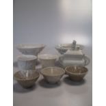 A group of eight Dehua and Dehua type cups, Qing Dynasty and later, comprising seven graduated '