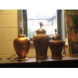 A modern gilt vase lamp and two similar (3)