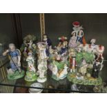 A group of 19th century Staffordshire figures to include the 'Pig Tythe' group, a figure of a