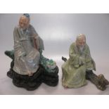 Two Chinese porcelain figures of seated sages, Republic Period C1920-30, one holding a peach staff