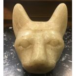 An Egyptian large carved stone head of a cat, 15 x 15 cm