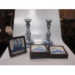 A set of six 18th century Dutch Delft blue & white tiles decorated with boats, mermaids etc.