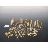 A collection of vintage ivory and bone items including two stanhopes, cigarette holders, bobbins,