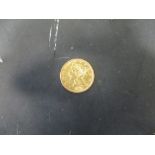A gold USA $5