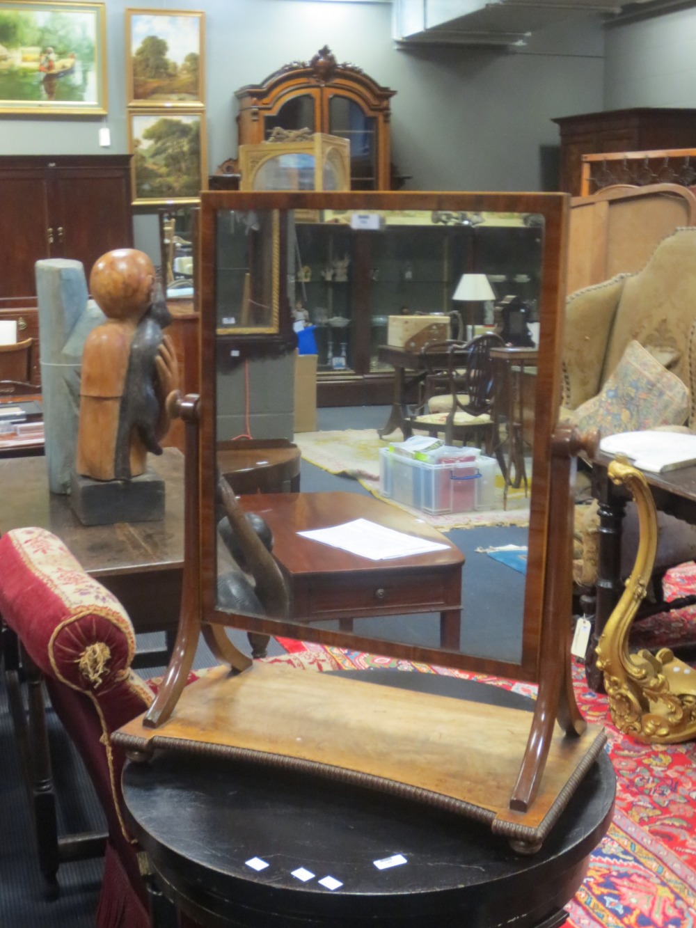 A Regency mahogany swing mirror