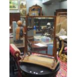 A Regency mahogany swing mirror