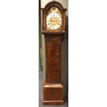 A George III walnut longcase clock circa 1760, the break arch hood with three ball finials,