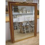 A modern gilt and painted frame mirror, with ribbon cresting