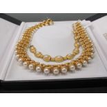 An archeological revival style collar necklace set with faux pearls, and matched bracelet, cased