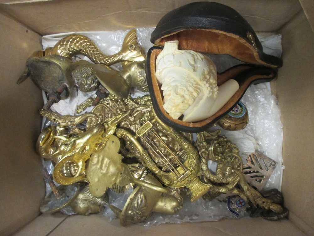 A collection of brass and gilt metal mounts and decorative ornaments