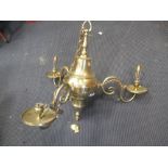 A brass three branch chandelier