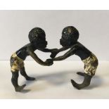 An Austrian coal painted bronze of two African wrestling boys, numbered underneath "7463"