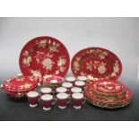 A Wedgwood red and cream dinner service