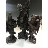 Three Chinese rosewood figures, Late Qing Dynasty/early Republic representing two luohan and a