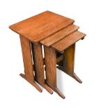 An Art Deco nest of oak tables, with rounded rectangular tops on stylised trestle supports 50 x 41 x