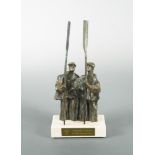 A mid-20th century bronze model of two oarsmen, standing side-by-side, each holding their oar,