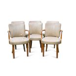 A set of six Art Deco walnut dining chairs, comprising four singles and a pair of carvers