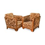A pair of Art Deco club armchairs, the upholstered backs and seat within angled walnut frames and