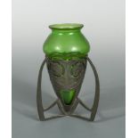 Archibald Knox for Liberty & Co., a Tudric pewter vase, shape no. 0226 with green glass liner by