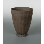 Keith Murray for Wedgwood, a brown basalt vase, of tapering cylindrical form, printed and