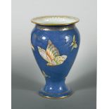 A Wedgwood Butterfly lustre trumpet vase, the blue power lustre vase with butterfly decoration and