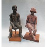 J D Palmer, a stoneware figure of a seated woman on wooden plinth, together with another of a man,