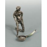 A late 20th century silver statue together with a mid 20th century spoon, the statue, double sponsor