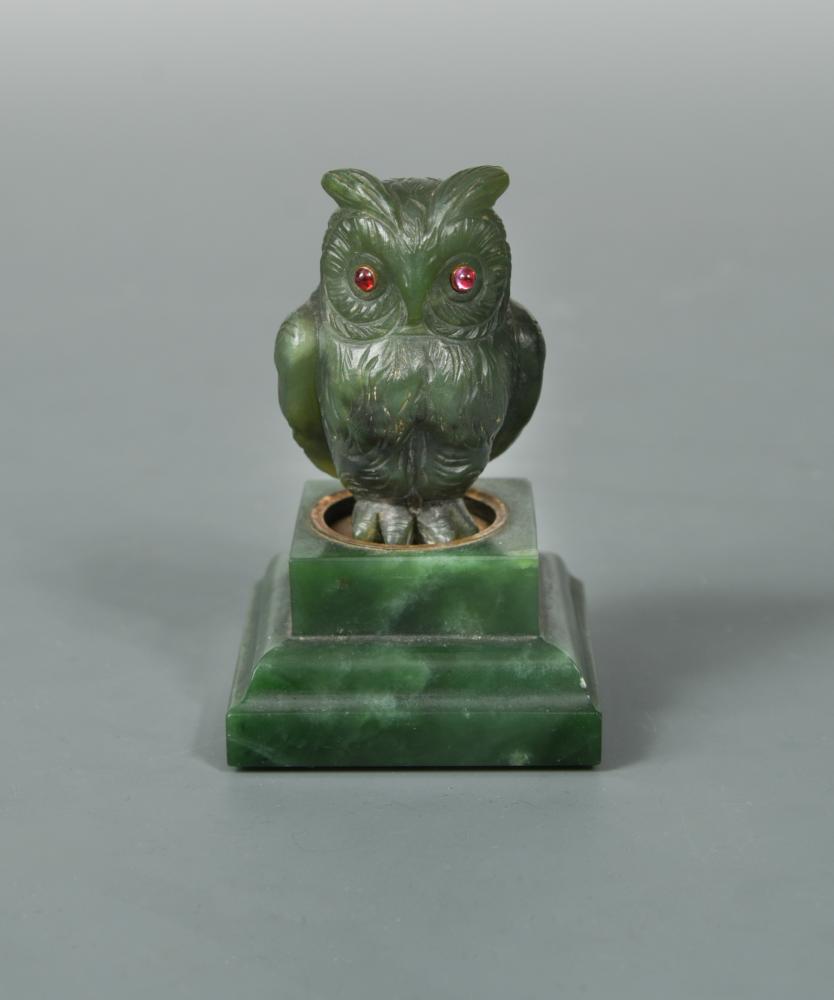 A jade and gem-set model of an owl in the manner of Fabergé, the carved jade owl with ruby eyes a