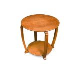 An Art Deco period blonde-oak occasional table with circular top, gently sweeping supports curving