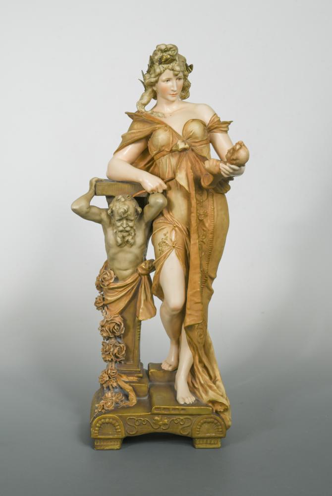 Ernst Wahliss (Austrian 1837-1900), an Art Nouveau pottery figure of a pretty young woman,