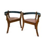 A pair of late 19th or early 20th century Norwegian painted three legged armchairs, with simulated