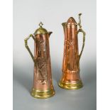 Two continental Art Nouveau brass and copper Jugendstil style lidded ewers, one with floral