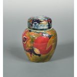 A small early Moorcroft Pomegranate pattern jar and cover, shape no. 769, painted with cut and