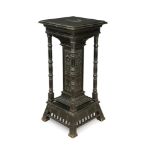 An Aesthetic period ebonsed pedestal column in the manner of Christopher Dresser, the square top