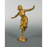 An Art Deco gilt bronze model of a dancer, signed F. Beck, modelled dancing on one leg, her arms