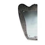 A 1940's Italian glass wall mirror, the shield shaped plate framed in etched and engraved glass with