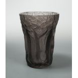 An early 20th century moulded amethyst glass vase, of flared cylindrical form moulded with a