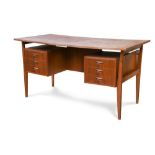 A mid-20th century Danish teak desk, the rectangular top over three drawers to either side raised on