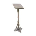 A late 19th century brass and iron lectern, the brass reading stand to a painted iron column and